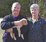Happy Labrador retriever owners