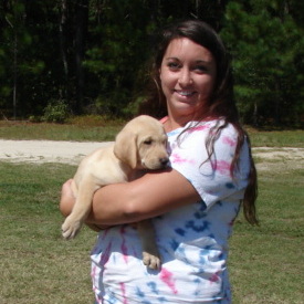 Young lady with yellow Labrador retriever